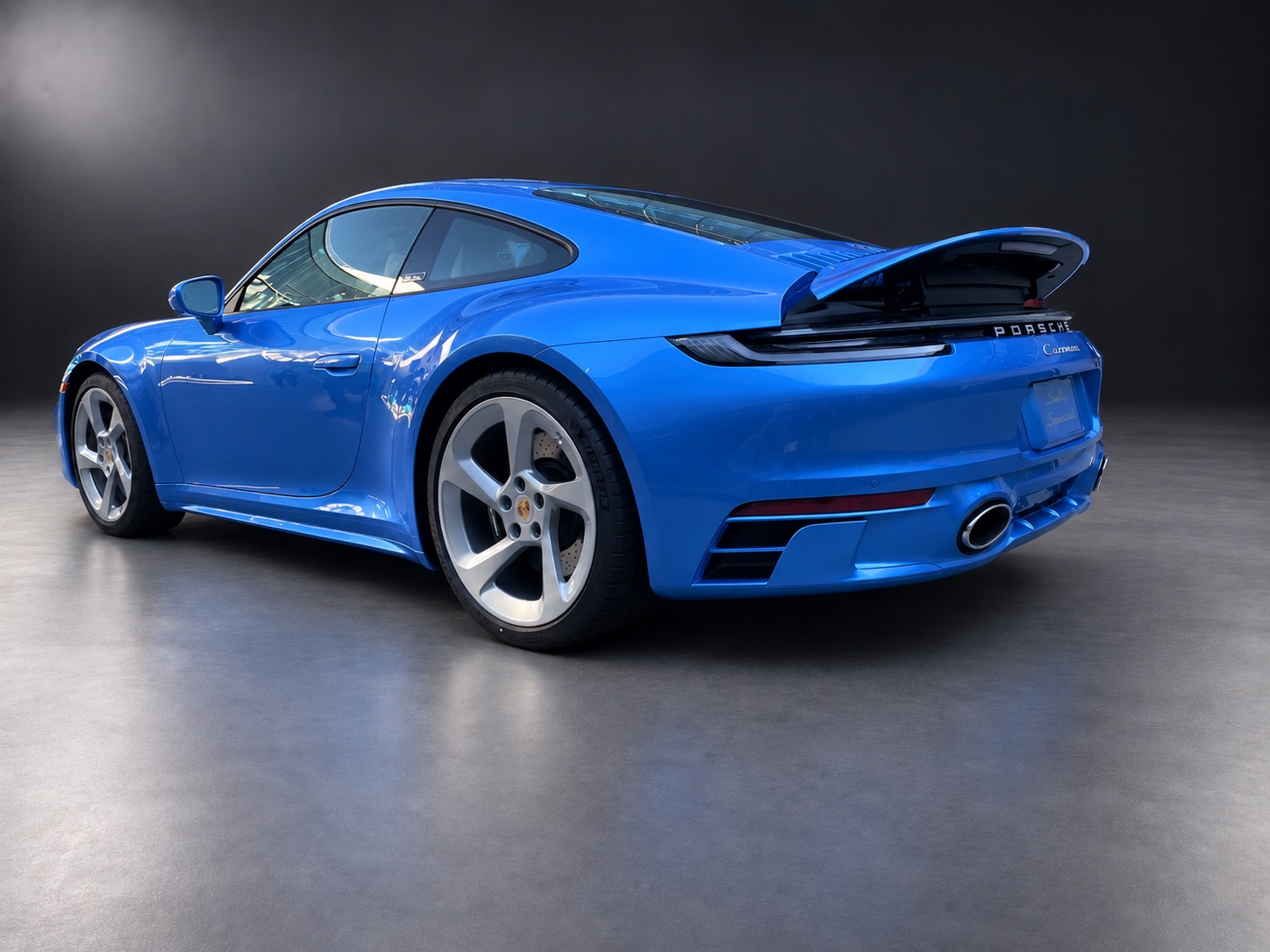 Sally Special in blue metallic paint with five-spoke wheels and raised rear spoiler