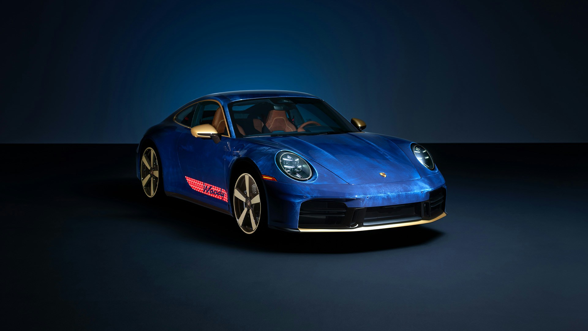 Woody-inspired Porsche 911 Carrera T with denim-effect blue paint and gold accents